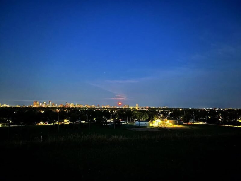 Full moon rising over the skyline